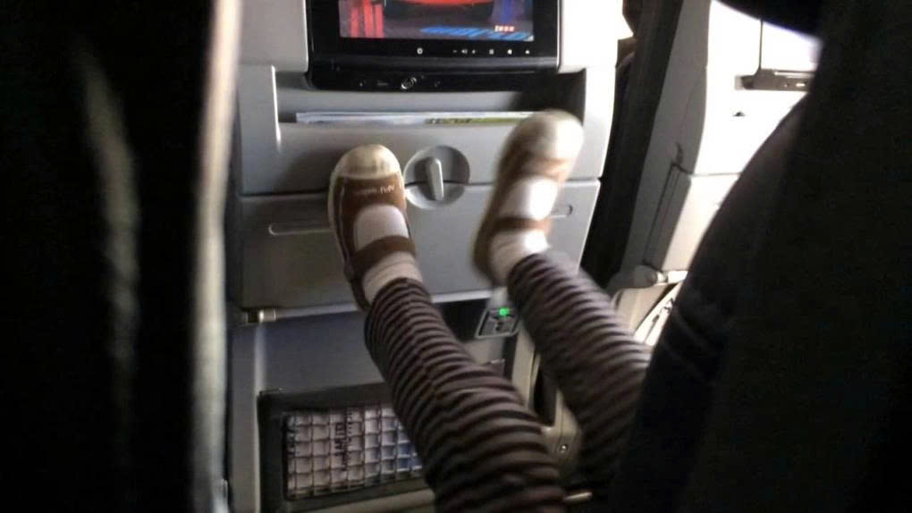 Children should be supervised and prevented from kicking the seat of the passenger in front on an airplane. (Photo: Storage Googleapis)