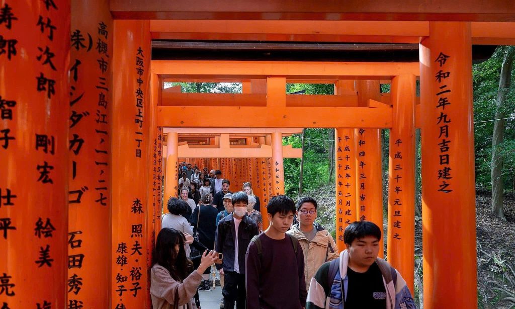 Nezu Shrine in Tokyo features 200 red torii gates and quiet gardens, a peaceful alternative to Fushimi Inari.