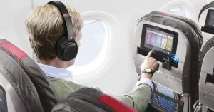 Passengers often wear headphones to listen to music or watch movies for entertainment during long flights. (Photo: Nerdtechy)