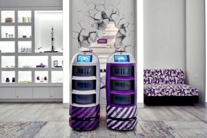 Two robots inside the Yotel hotel. Photo: Globe Trender.