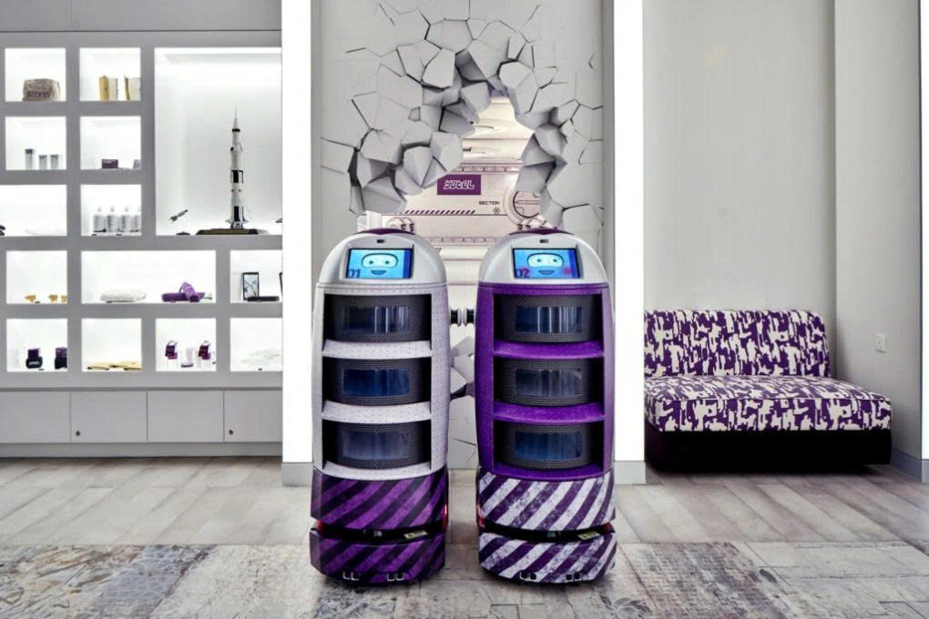 Two robots inside the Yotel hotel. Photo: Globe Trender.